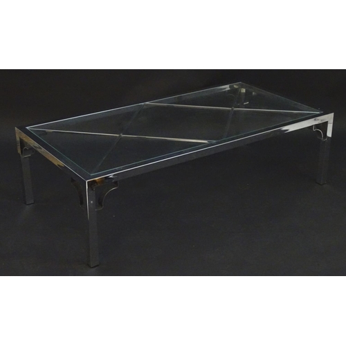 2218 - Vintage Retro mid Century modern: A large chromed and glass topped coffee table with cross bracing, ... 