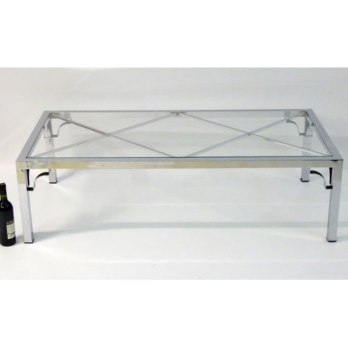 2218 - Vintage Retro mid Century modern: A large chromed and glass topped coffee table with cross bracing, ... 