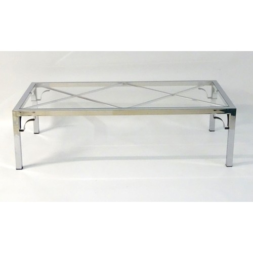 2218 - Vintage Retro mid Century modern: A large chromed and glass topped coffee table with cross bracing, ... 