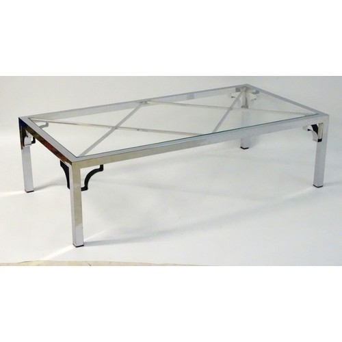 2218 - Vintage Retro mid Century modern: A large chromed and glass topped coffee table with cross bracing, ... 