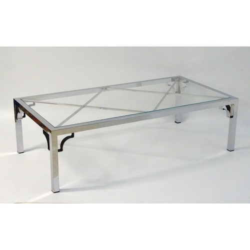 2218 - Vintage Retro mid Century modern: A large chromed and glass topped coffee table with cross bracing, ... 