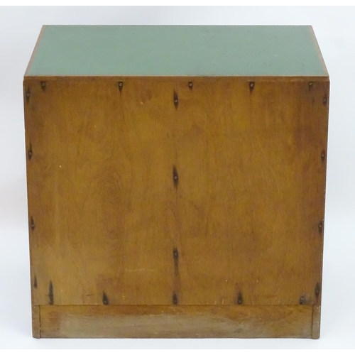 2219 - A mid 20thC cedar chest of drawers, comprising two flights of five drawers, with inset green vinyl t... 