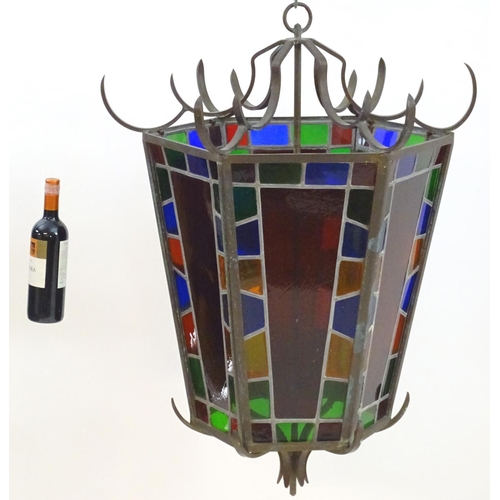 2243 - An early 20thC exceptionally large stained glass pendant lantern / light shade, of tapering hexagona... 