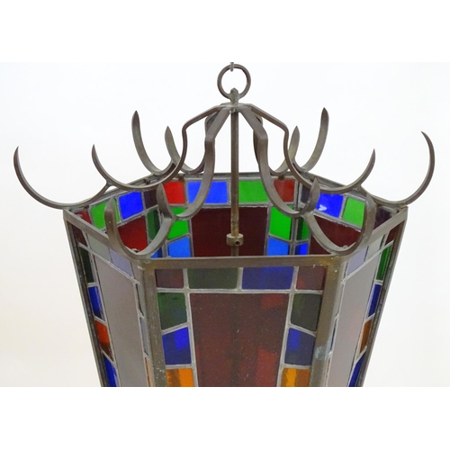 2243 - An early 20thC exceptionally large stained glass pendant lantern / light shade, of tapering hexagona... 