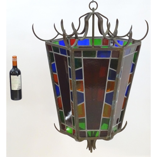 2243 - An early 20thC exceptionally large stained glass pendant lantern / light shade, of tapering hexagona... 