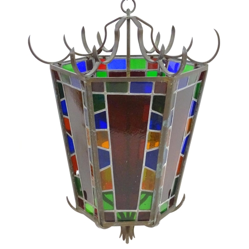 2243 - An early 20thC exceptionally large stained glass pendant lantern / light shade, of tapering hexagona... 