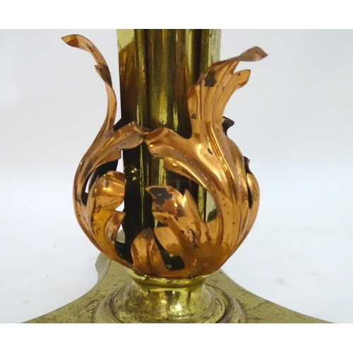 2246 - A 19thC Arts and Crafts brass standard lamp, converted to electricity, the height adjustable shaft s... 