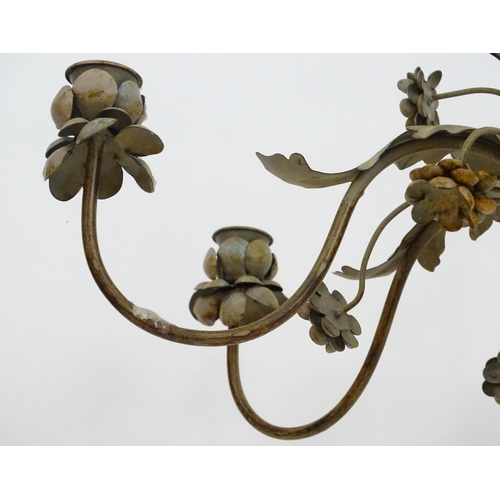 2250 - An early to mid 20thC patinated metal floor standing candelabra, the six cups formed as flower heads... 