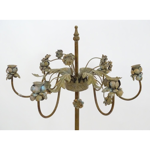 2250 - An early to mid 20thC patinated metal floor standing candelabra, the six cups formed as flower heads... 