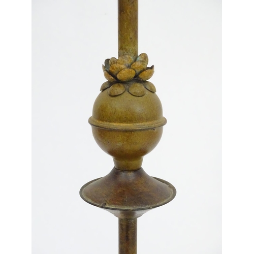 2250 - An early to mid 20thC patinated metal floor standing candelabra, the six cups formed as flower heads... 