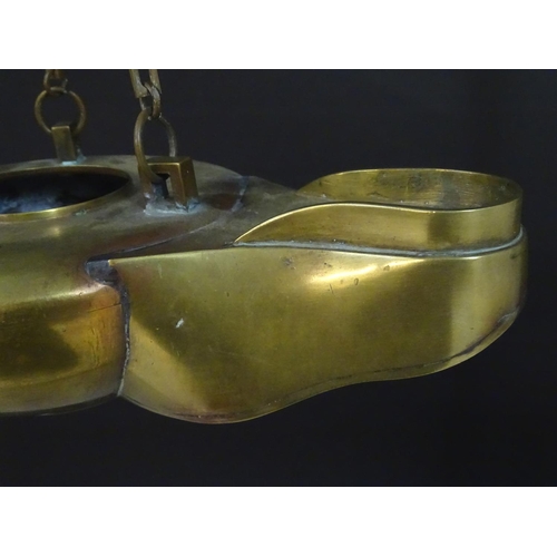 2251 - A 19thC brass hanging oil lamp formed as a large oversized 'genie' lantern. Approx. 13 1/2