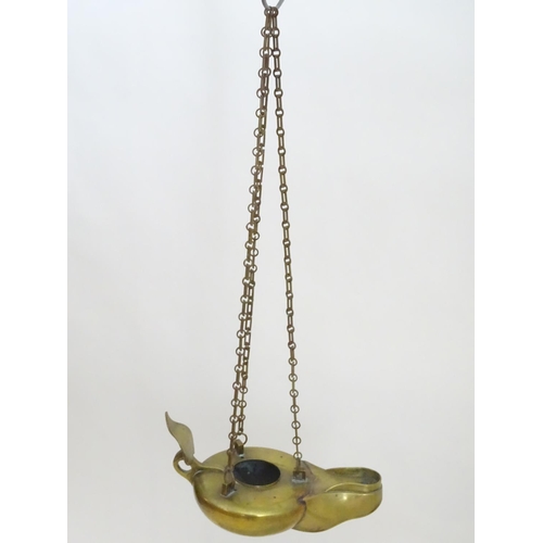 2251 - A 19thC brass hanging oil lamp formed as a large oversized 'genie' lantern. Approx. 13 1/2