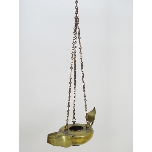 2251 - A 19thC brass hanging oil lamp formed as a large oversized 'genie' lantern. Approx. 13 1/2