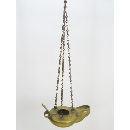 2251 - A 19thC brass hanging oil lamp formed as a large oversized 'genie' lantern. Approx. 13 1/2