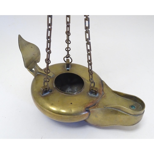 2251 - A 19thC brass hanging oil lamp formed as a large oversized 'genie' lantern. Approx. 13 1/2