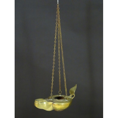 2251 - A 19thC brass hanging oil lamp formed as a large oversized 'genie' lantern. Approx. 13 1/2