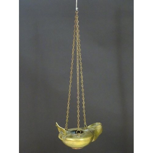 2251 - A 19thC brass hanging oil lamp formed as a large oversized 'genie' lantern. Approx. 13 1/2