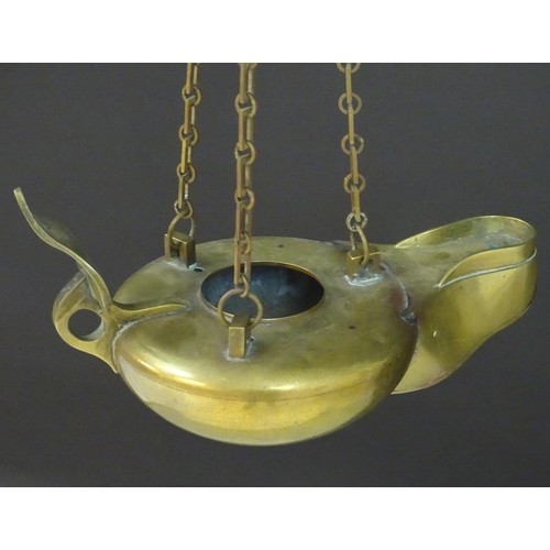 2251 - A 19thC brass hanging oil lamp formed as a large oversized 'genie' lantern. Approx. 13 1/2