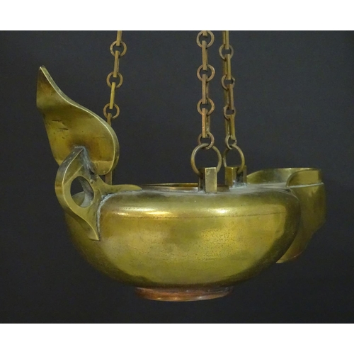 2251 - A 19thC brass hanging oil lamp formed as a large oversized 'genie' lantern. Approx. 13 1/2