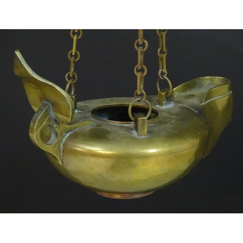 2251 - A 19thC brass hanging oil lamp formed as a large oversized 'genie' lantern. Approx. 13 1/2