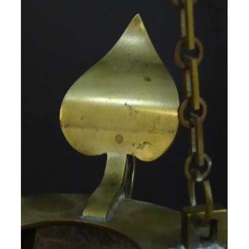 2251 - A 19thC brass hanging oil lamp formed as a large oversized 'genie' lantern. Approx. 13 1/2