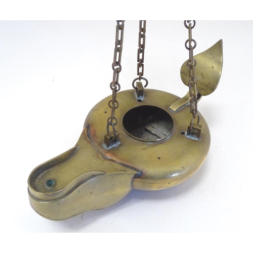 2251 - A 19thC brass hanging oil lamp formed as a large oversized 'genie' lantern. Approx. 13 1/2