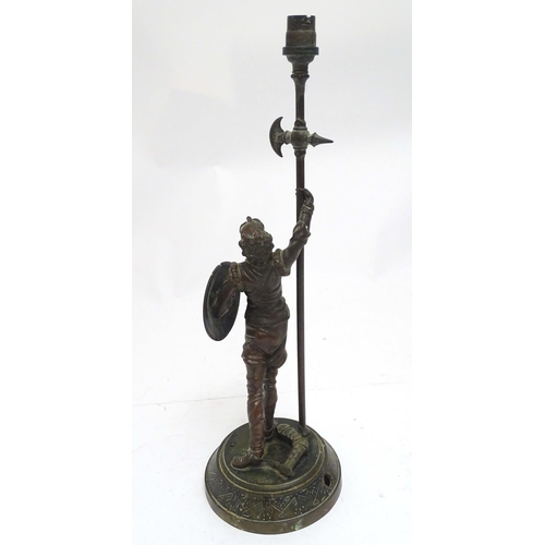 2255 - A Victorian cast figural table lamp, formed as Don Quixote, stamped to the reverse, the base with re... 