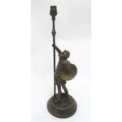 2255 - A Victorian cast figural table lamp, formed as Don Quixote, stamped to the reverse, the base with re... 