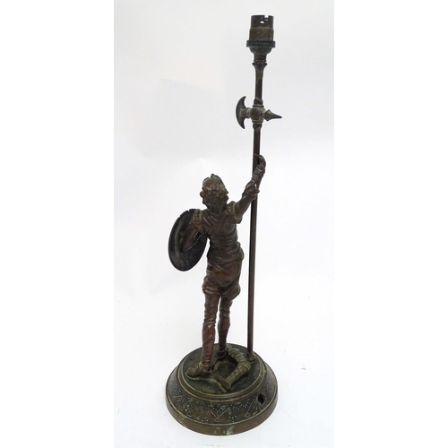 2255 - A Victorian cast figural table lamp, formed as Don Quixote, stamped to the reverse, the base with re... 