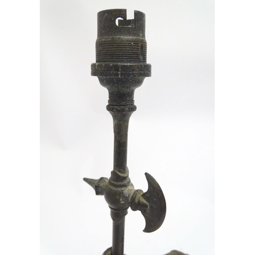 2255 - A Victorian cast figural table lamp, formed as Don Quixote, stamped to the reverse, the base with re... 