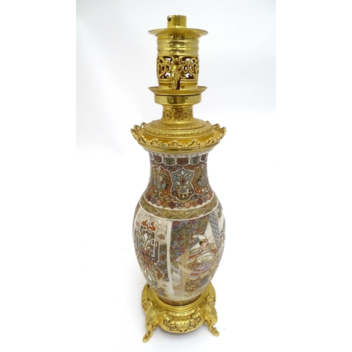 2260 - An early 20thC Satsuma vase table light, with ornate gilt base and light fitting, 20 1/2