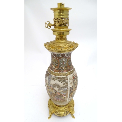 2260 - An early 20thC Satsuma vase table light, with ornate gilt base and light fitting, 20 1/2