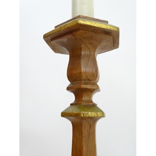 2262 - A 20thC pine standard lamp, of hexagonal stepped sectional form, with gilt edging and faux candle to... 