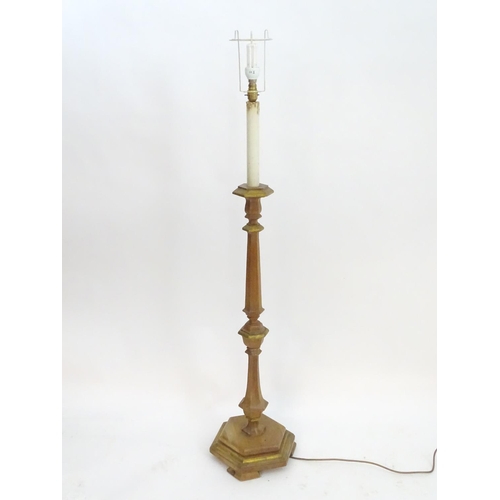 2262 - A 20thC pine standard lamp, of hexagonal stepped sectional form, with gilt edging and faux candle to... 