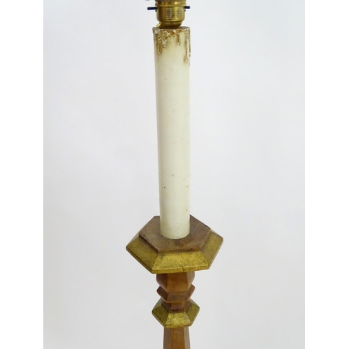 2262 - A 20thC pine standard lamp, of hexagonal stepped sectional form, with gilt edging and faux candle to... 