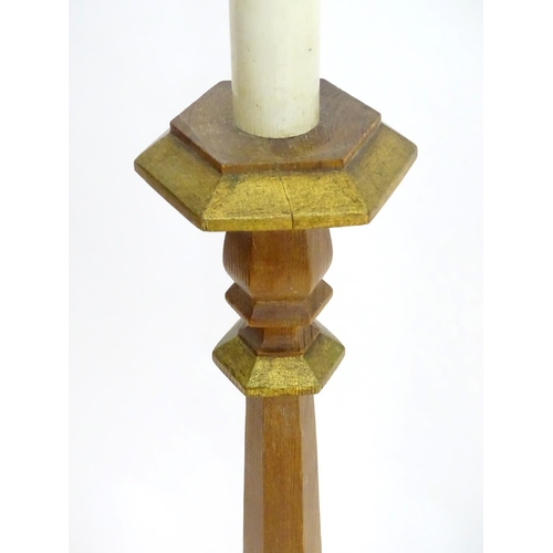 2262 - A 20thC pine standard lamp, of hexagonal stepped sectional form, with gilt edging and faux candle to... 