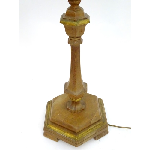 2262 - A 20thC pine standard lamp, of hexagonal stepped sectional form, with gilt edging and faux candle to... 