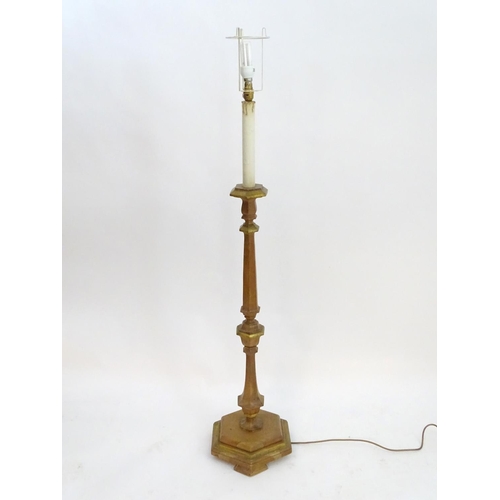 2262 - A 20thC pine standard lamp, of hexagonal stepped sectional form, with gilt edging and faux candle to... 