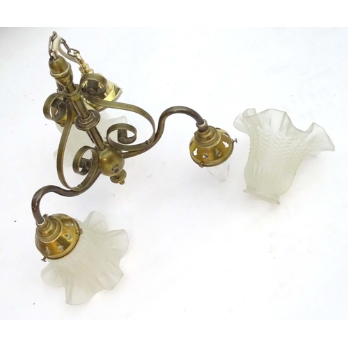 2267 - An early 20thC pendant three branch ceiling light , the brass mount with scroll decoration, stamped ... 