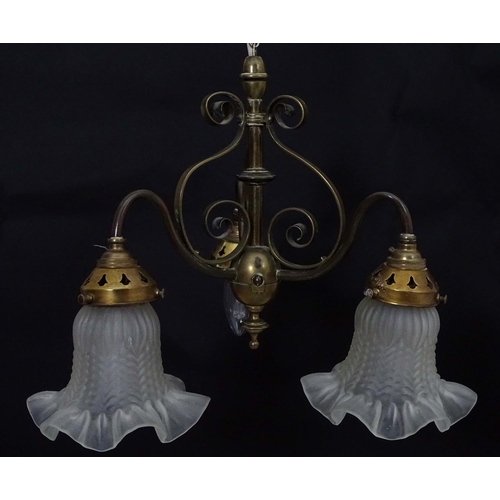 2267 - An early 20thC pendant three branch ceiling light , the brass mount with scroll decoration, stamped ... 