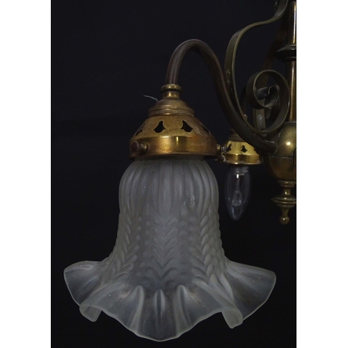 2267 - An early 20thC pendant three branch ceiling light , the brass mount with scroll decoration, stamped ... 