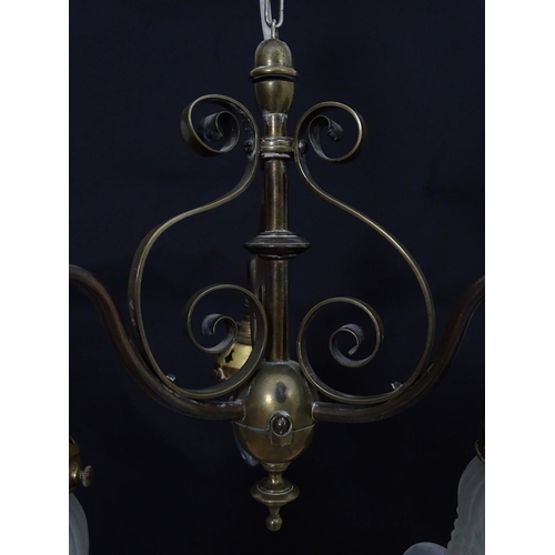 2267 - An early 20thC pendant three branch ceiling light , the brass mount with scroll decoration, stamped ... 