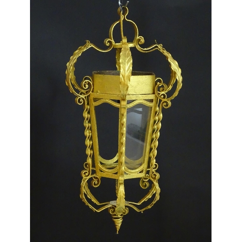 2271 - A gilt metal pendant lantern of hexagonal form with scrolled detail, approx. 27