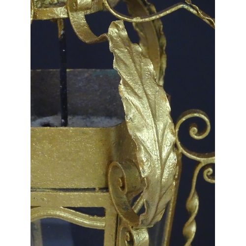 2271 - A gilt metal pendant lantern of hexagonal form with scrolled detail, approx. 27