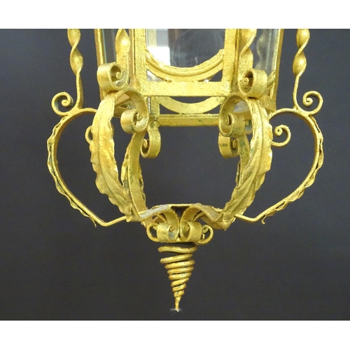 2271 - A gilt metal pendant lantern of hexagonal form with scrolled detail, approx. 27