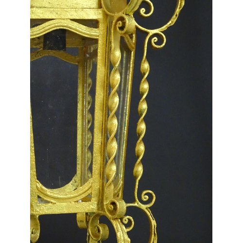 2271 - A gilt metal pendant lantern of hexagonal form with scrolled detail, approx. 27