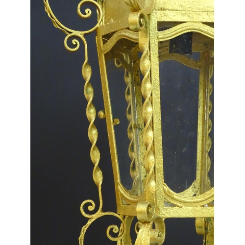 2271 - A gilt metal pendant lantern of hexagonal form with scrolled detail, approx. 27