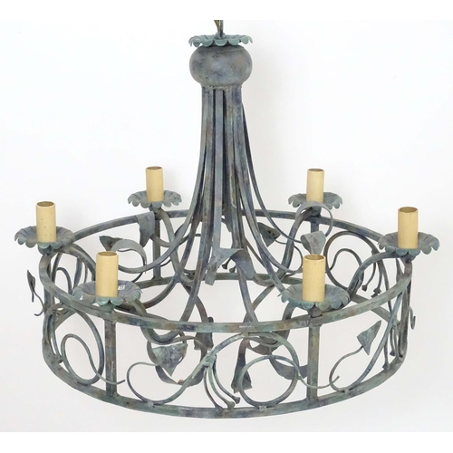 2274 - A 20thC pendant ceiling light, the circular frame supporting six lamps, with ivy and lily leaf decor... 