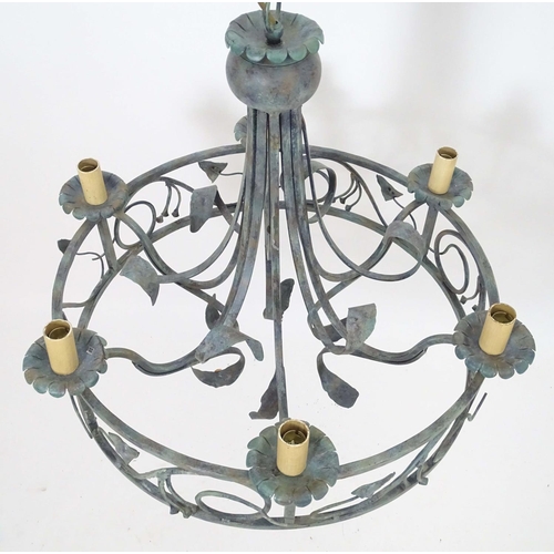 2274 - A 20thC pendant ceiling light, the circular frame supporting six lamps, with ivy and lily leaf decor... 