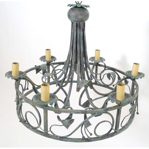 2274 - A 20thC pendant ceiling light, the circular frame supporting six lamps, with ivy and lily leaf decor... 